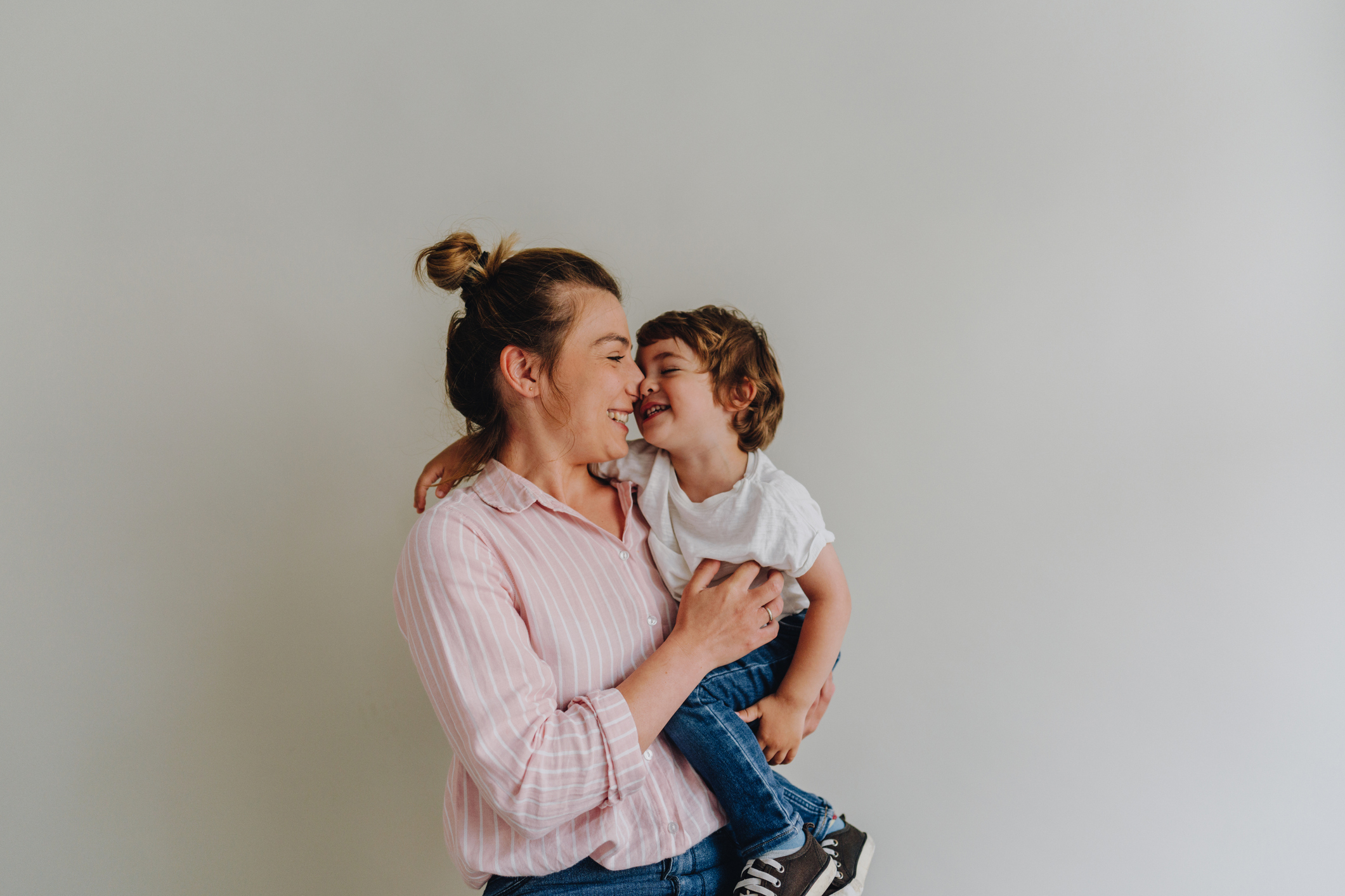 A young woman holding her child